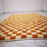 Orange checkered rug made entirely by hand