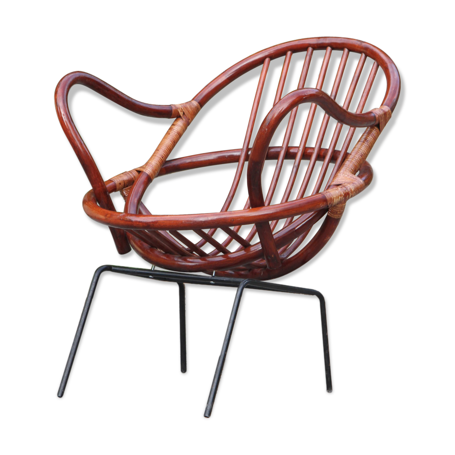 Rattan shell armchair with metal feet