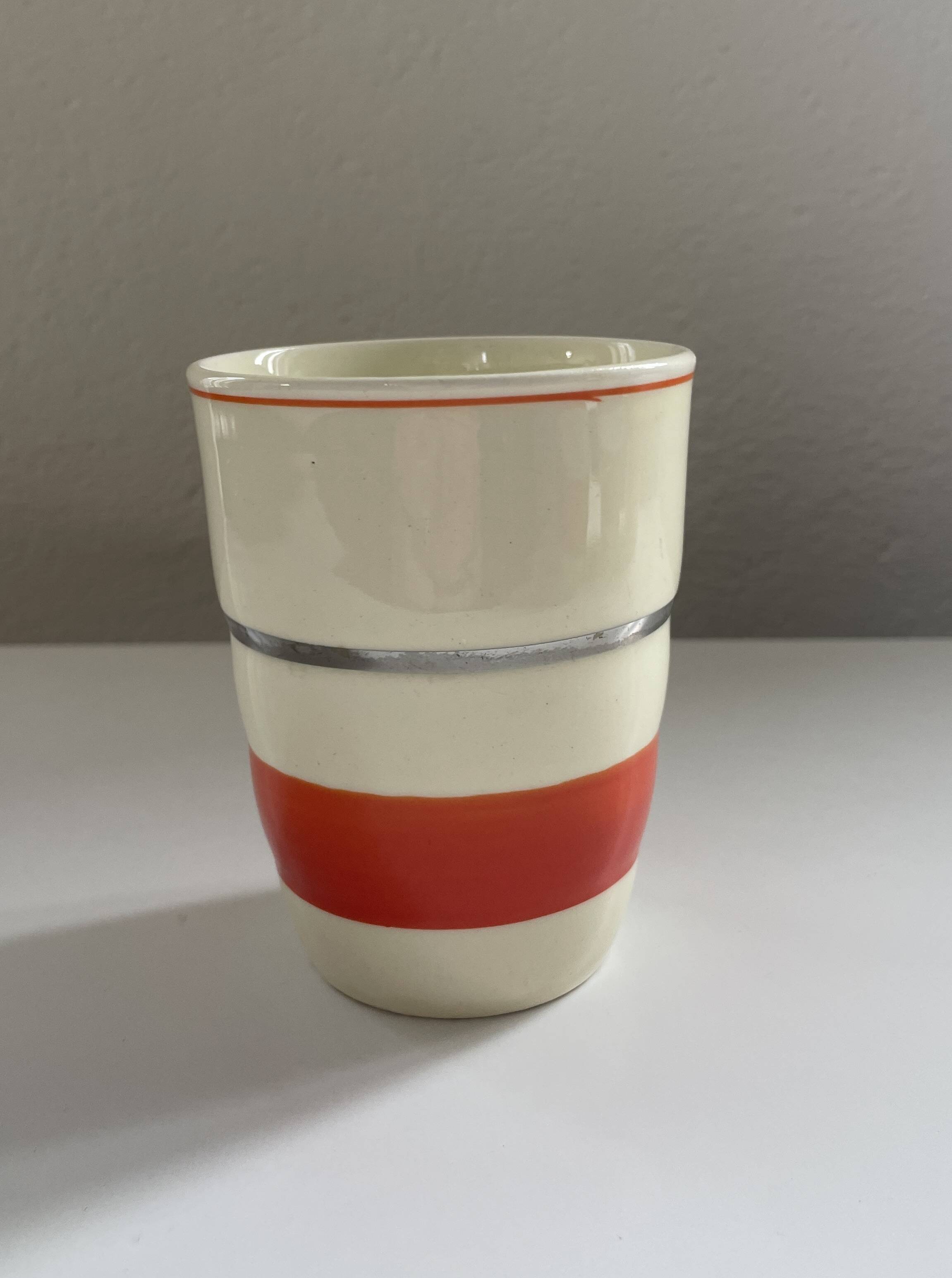Red, white and silver porcelain jug set by Edmond Bellefroid for Robo.