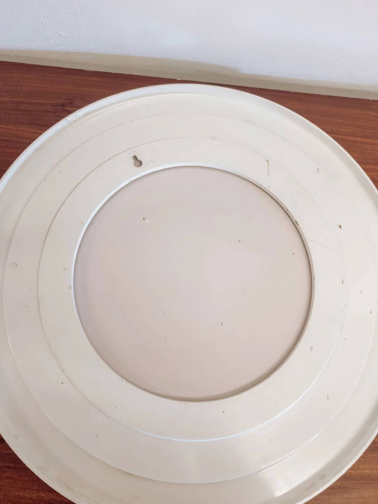 Large vintage round mirror with a white border.