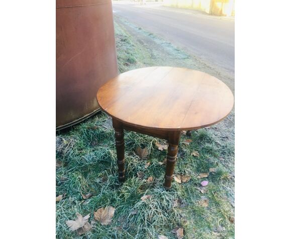Extendable round table in walnut wood 1930