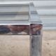 Pair of side tables in chrome metal and glass