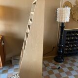 Painted wooden display shelf with an incline