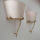 Pair of vintage wall lights, solid brass and ecru fabric, France 1980