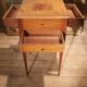 Nightstand with veneer and 4 drawers.