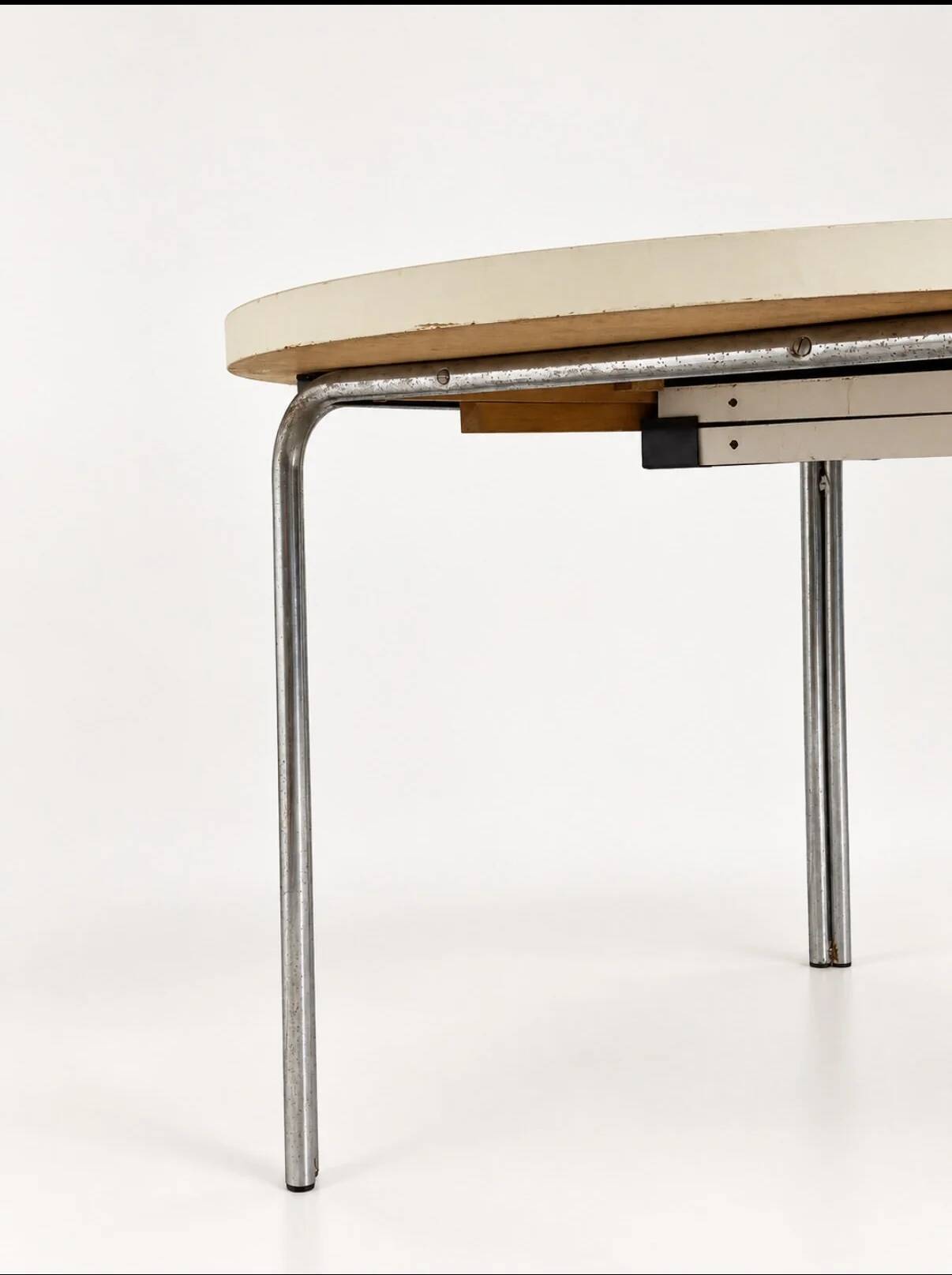 Vintage round extendable dining table, white laminate on chrome legs.