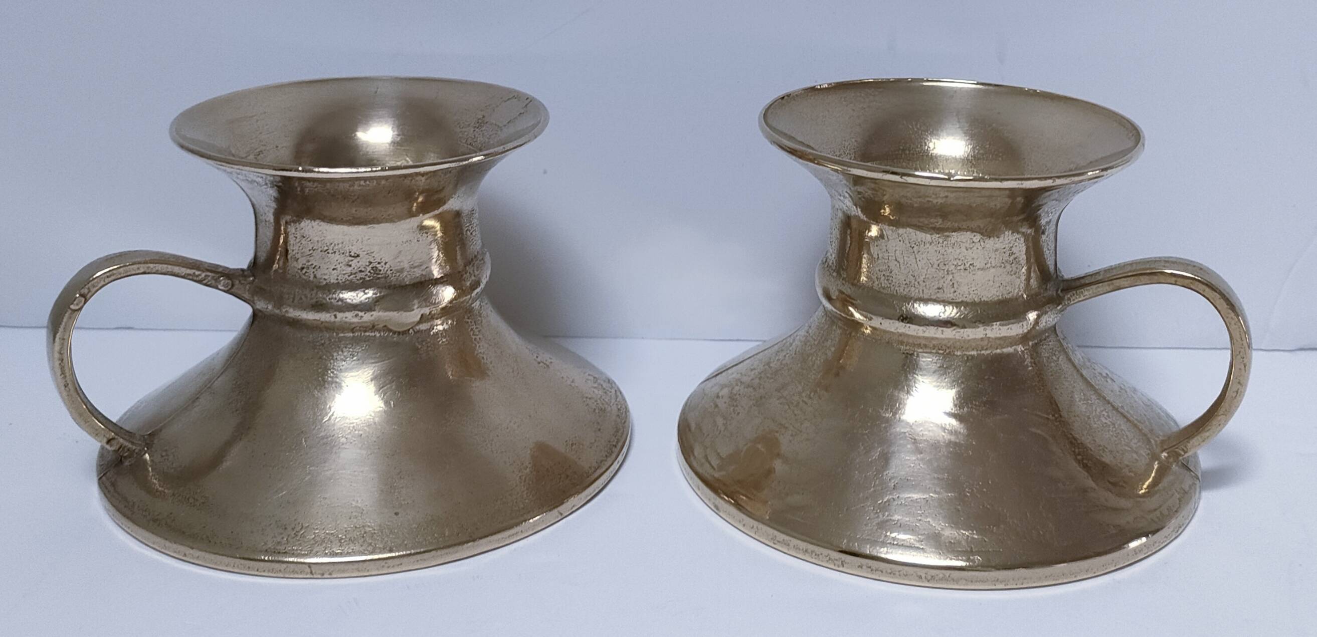 Pair of vintage solid brass hand candlesticks
