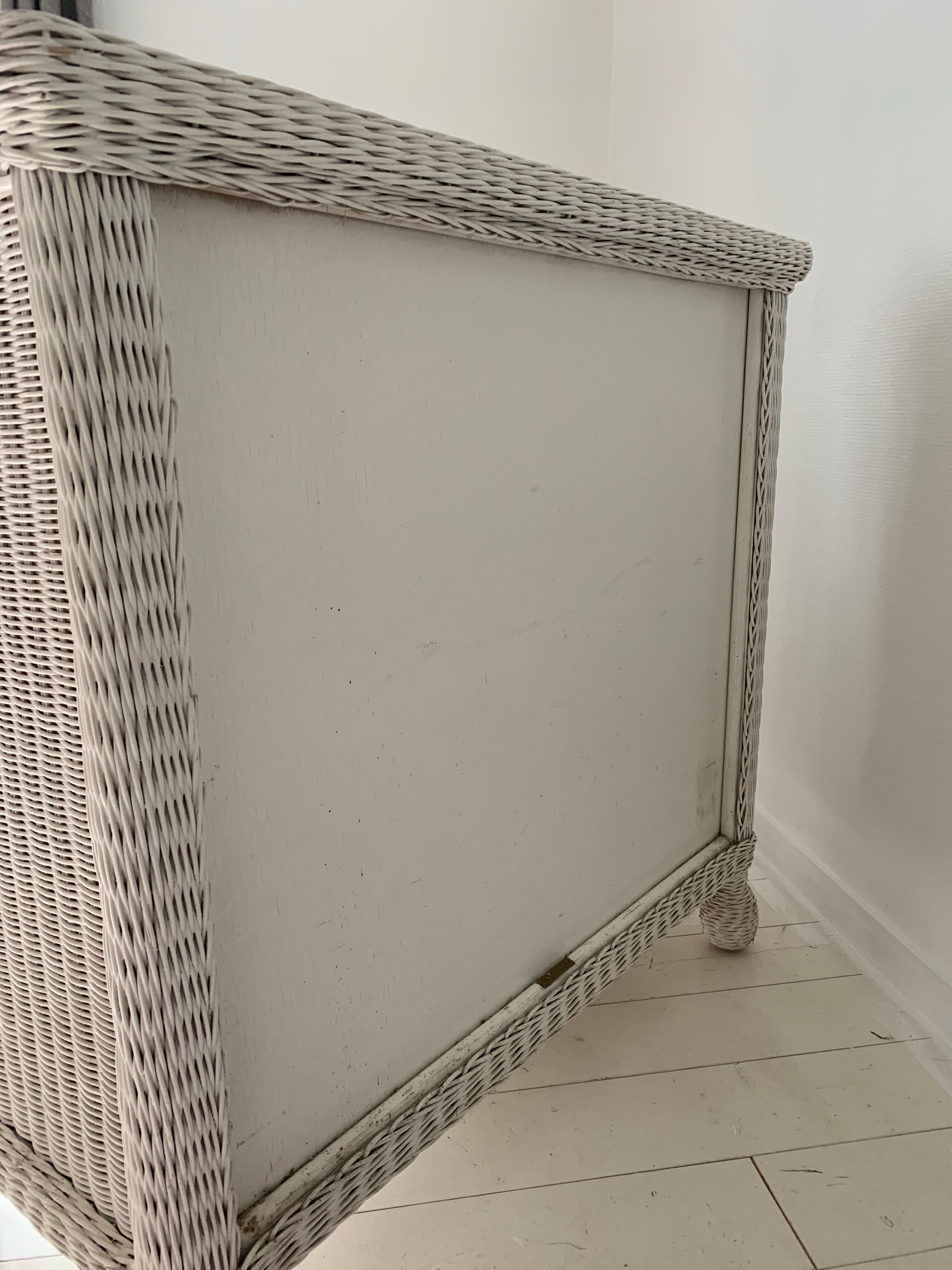 White dresser in vintage rattan