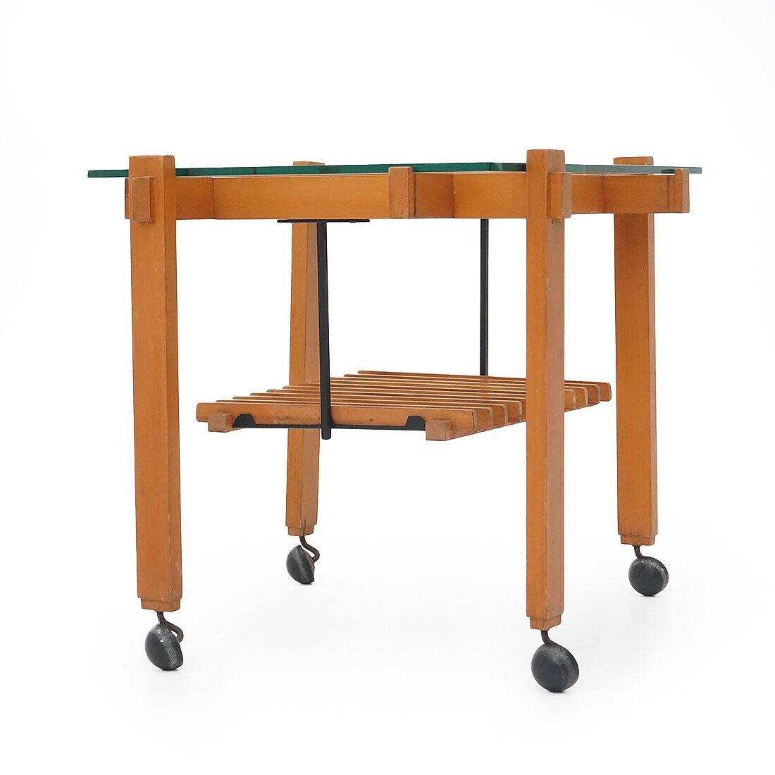 Wood and glass coffee table with wheels, 1960s.