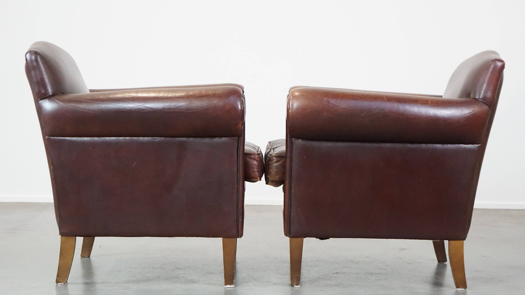 Set of 2 design armchairs made of sheepskin