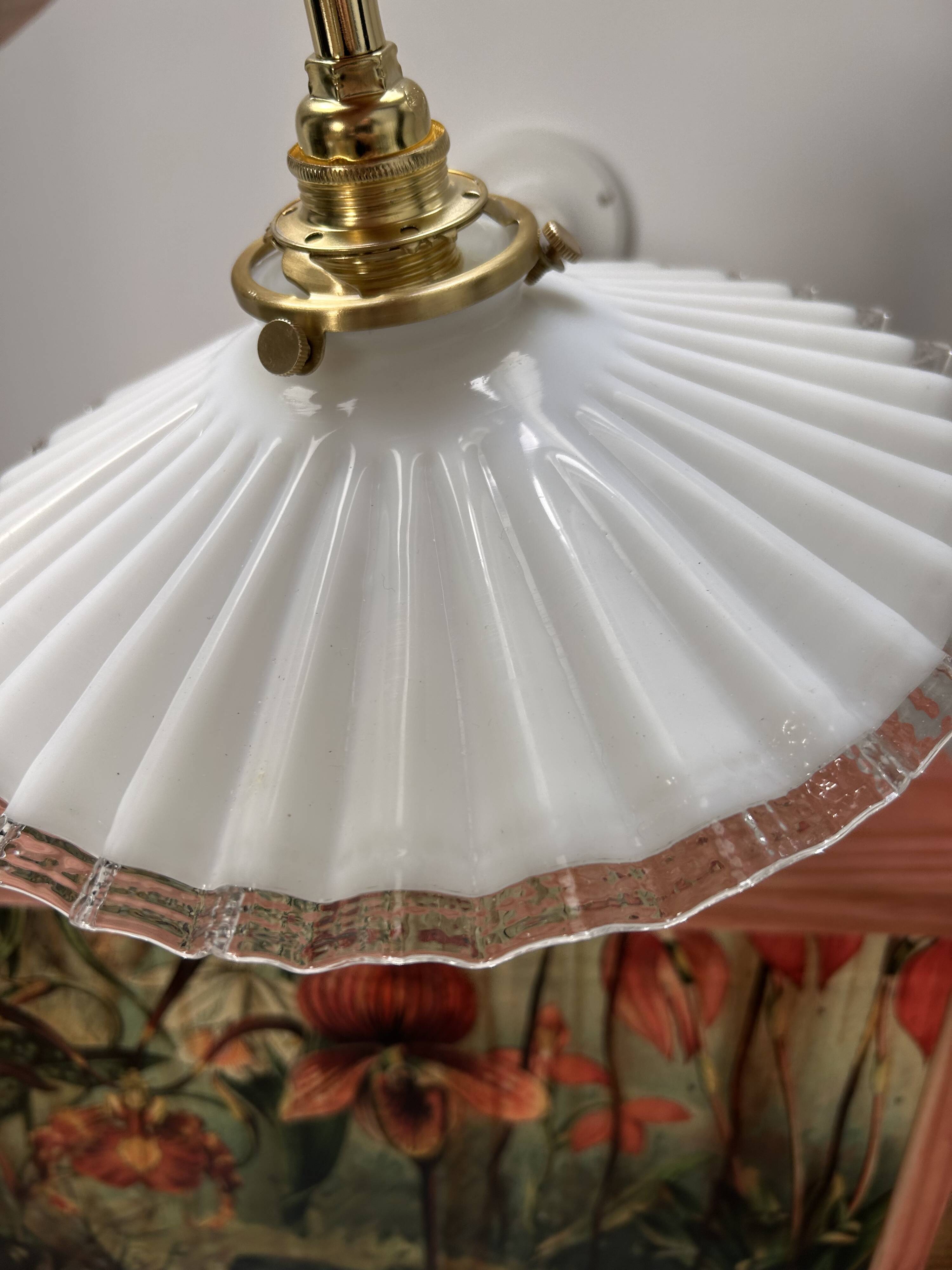 Two wall sconces in serrated white opaline
