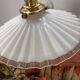 Two wall sconces in serrated white opaline