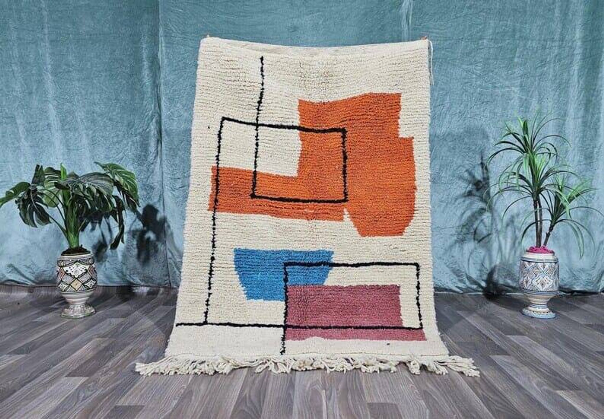 Traditional handmade wool Berber rug with colourful patterns.