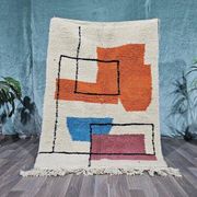 Traditional handmade wool Berber rug with colourful patterns.