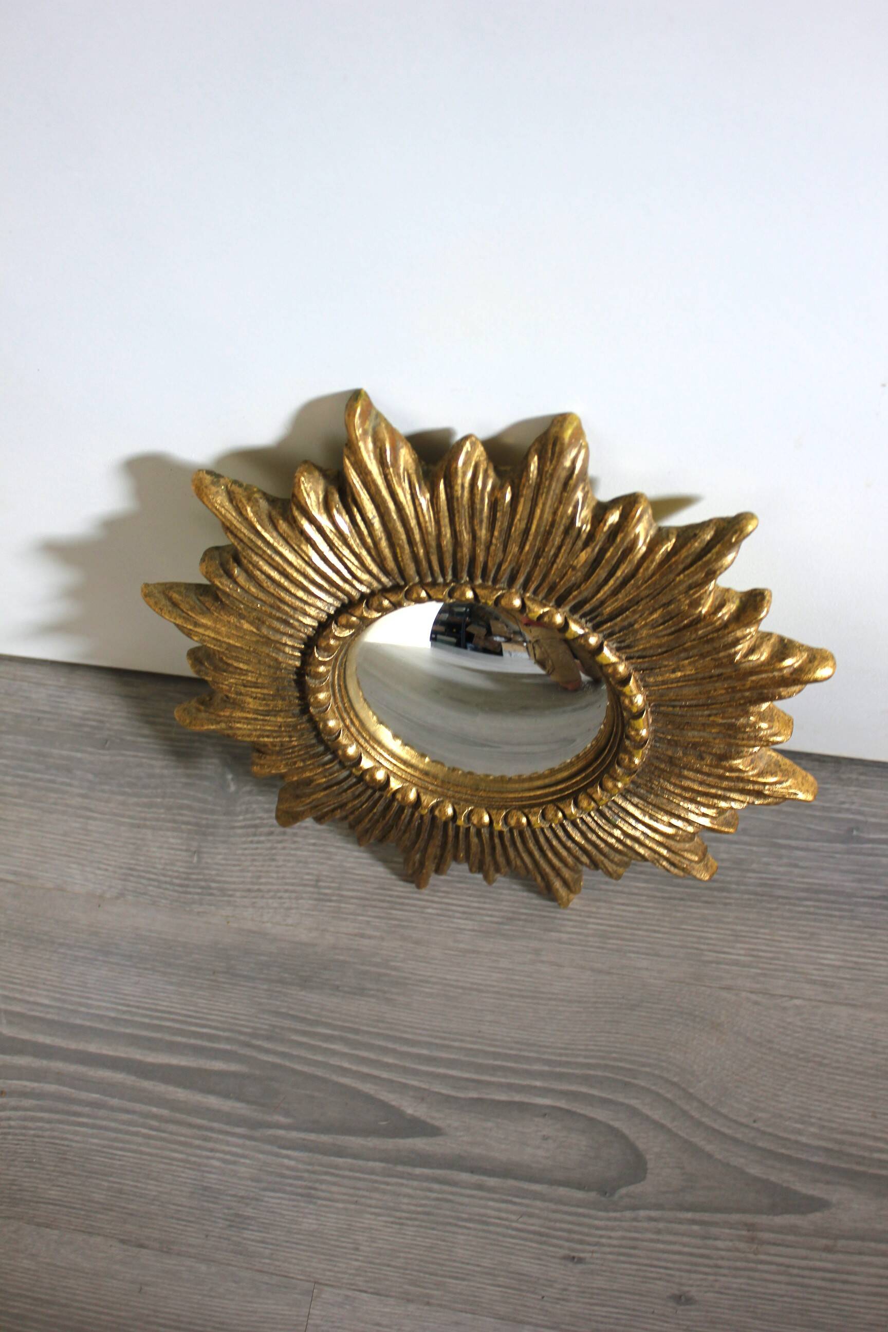 Golden sunburst convex vintage mirror from the 1960s.