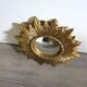 Golden sunburst convex vintage mirror from the 1960s.