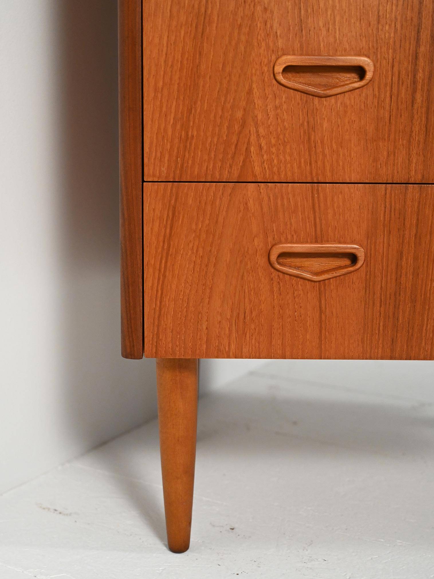Scandinavian teak chest of drawers with sculpted recessed pulls