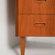 Scandinavian teak chest of drawers with sculpted recessed pulls