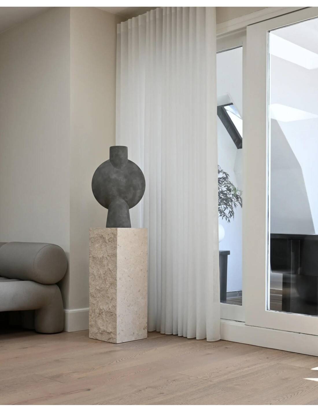 Column, limestone sheath, contemporary work.