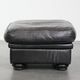 Large and timeless black ottoman made of cowhide leather in English style