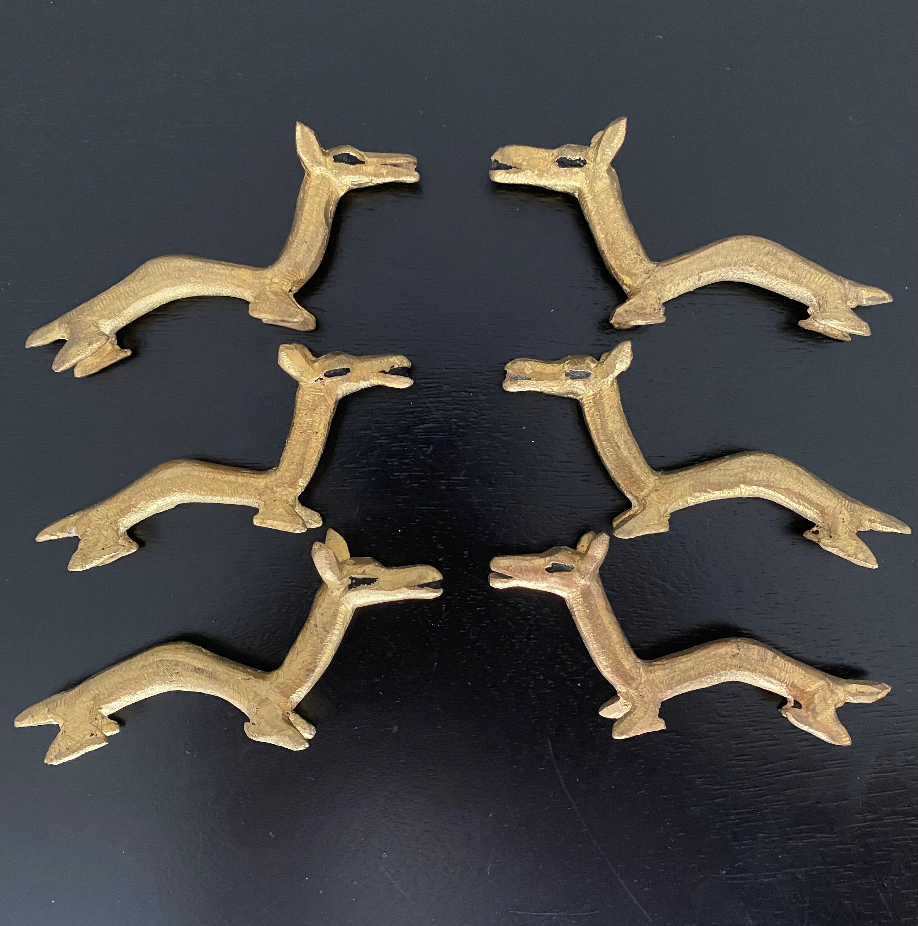6 brass dromedary-shaped knife holders