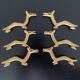 6 brass dromedary-shaped knife holders