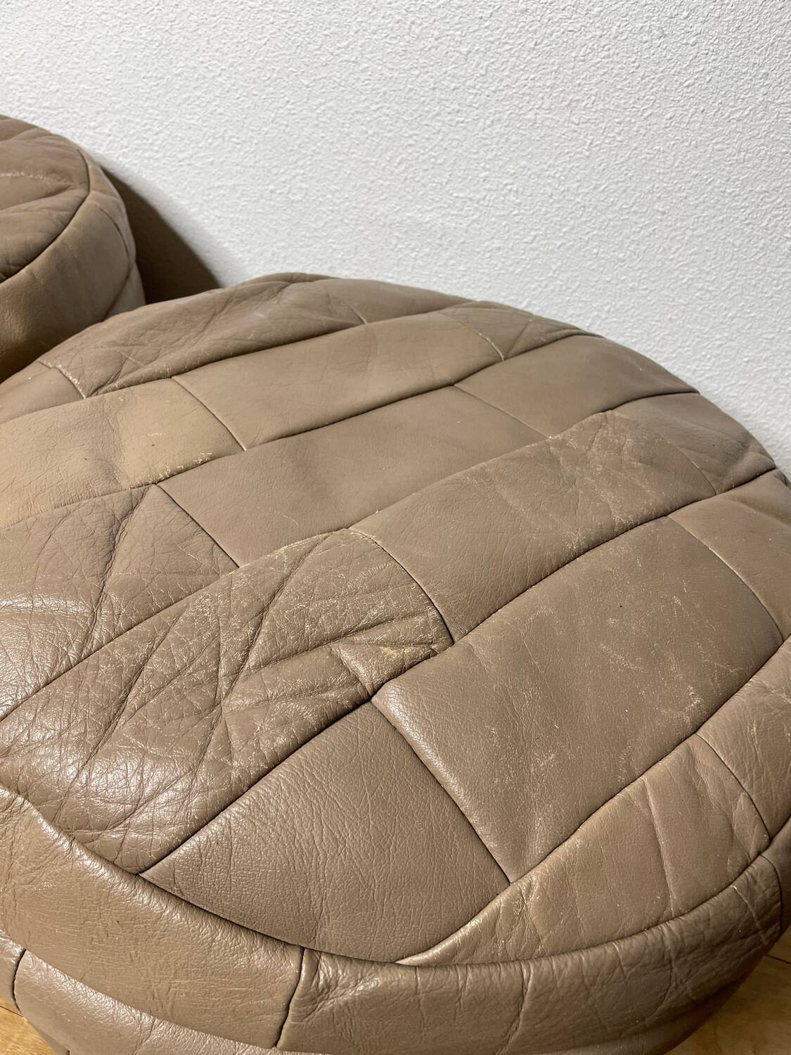 Pair of De Sède patchwork leather poufs