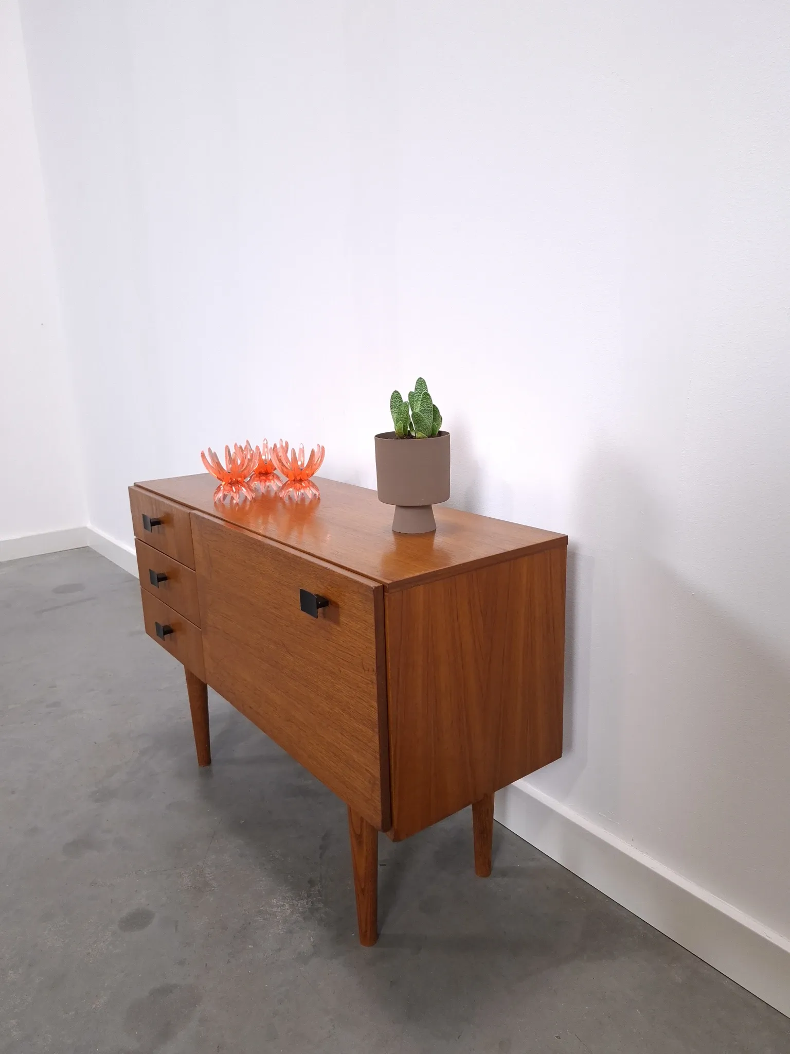 Vintage small teak cabinet with drawers, flap and black handles, hallway cabinet.