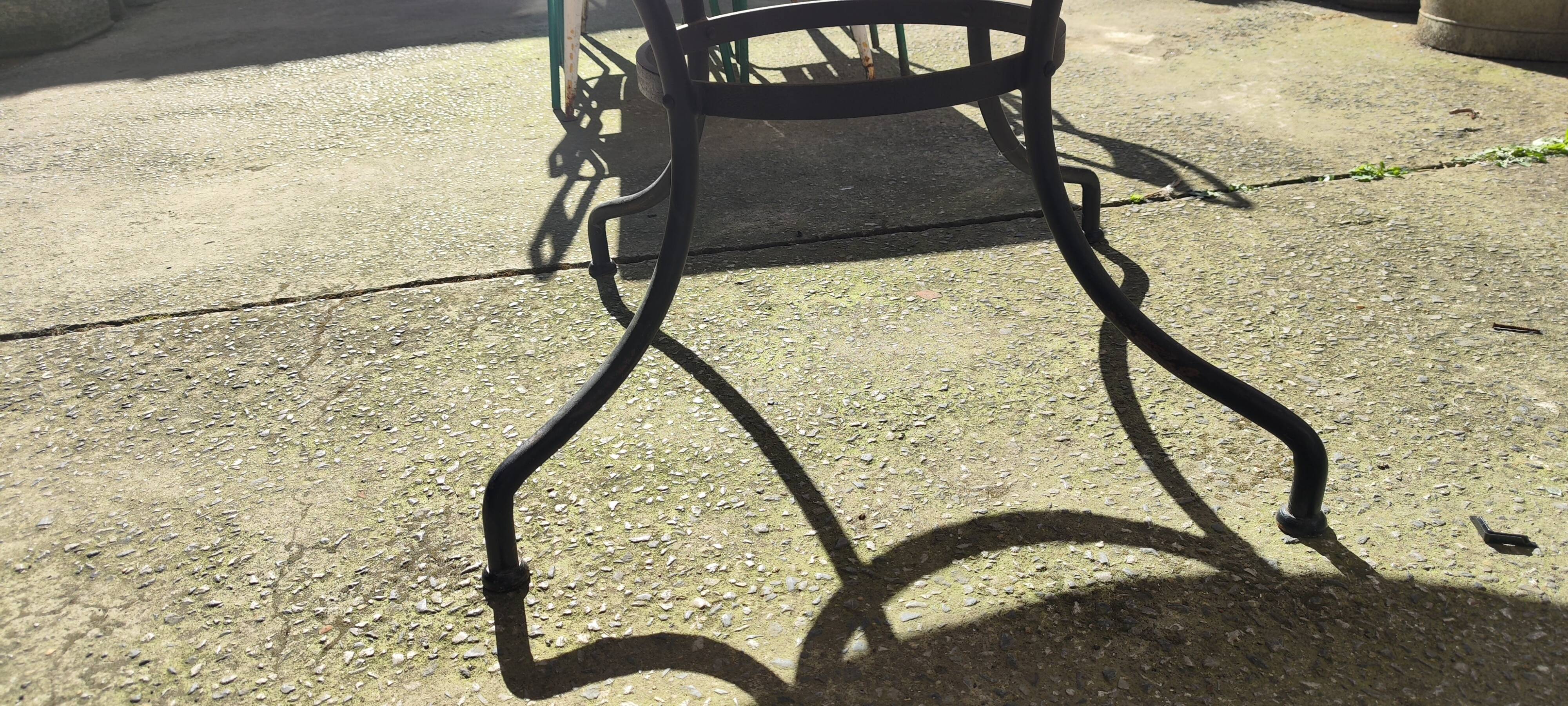 Round zellige table with metal legs and green tile top