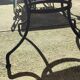 Round zellige table with metal legs and green tile top