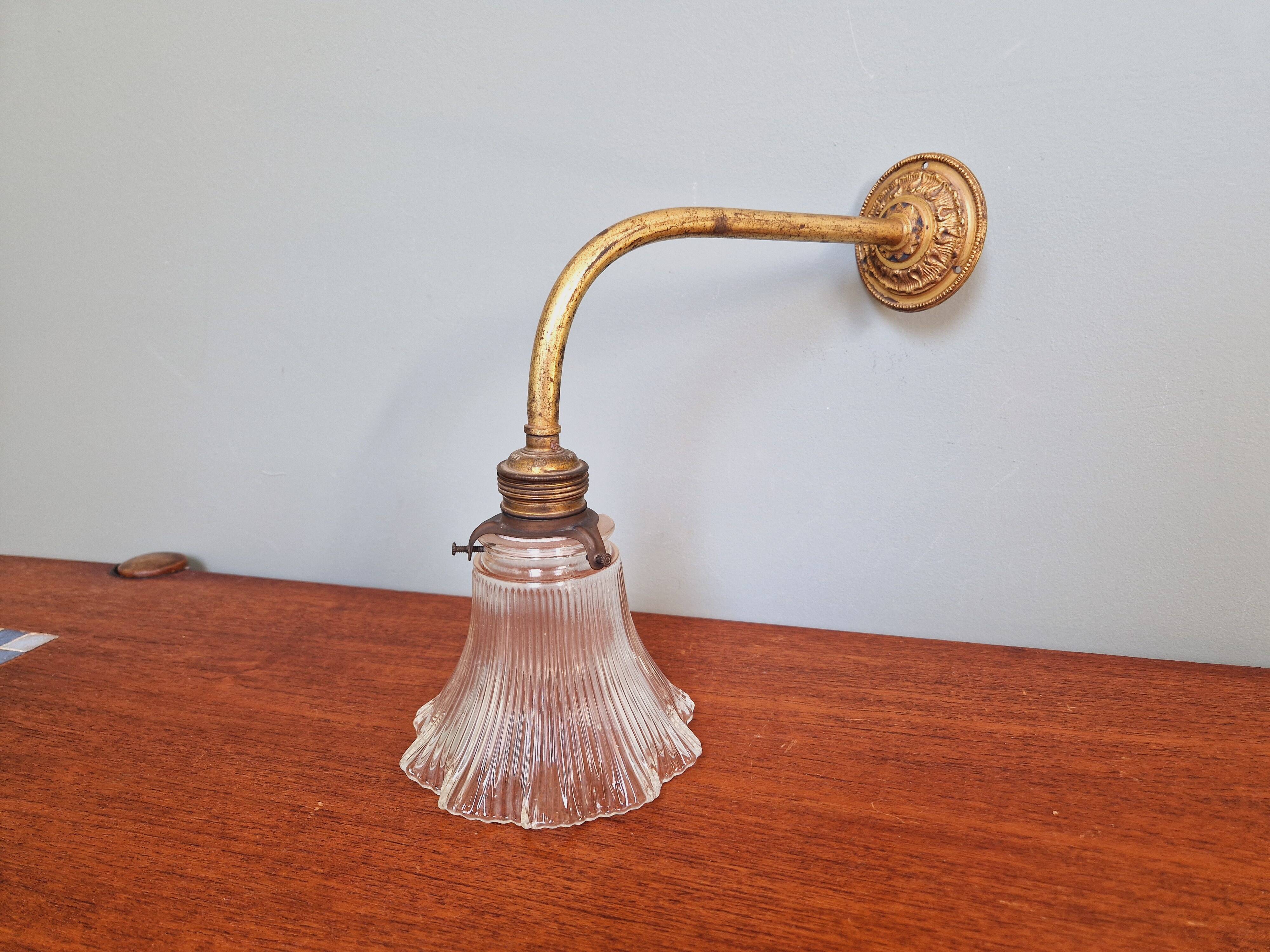 Bronze wall light with grooved clear glass, early 20th century