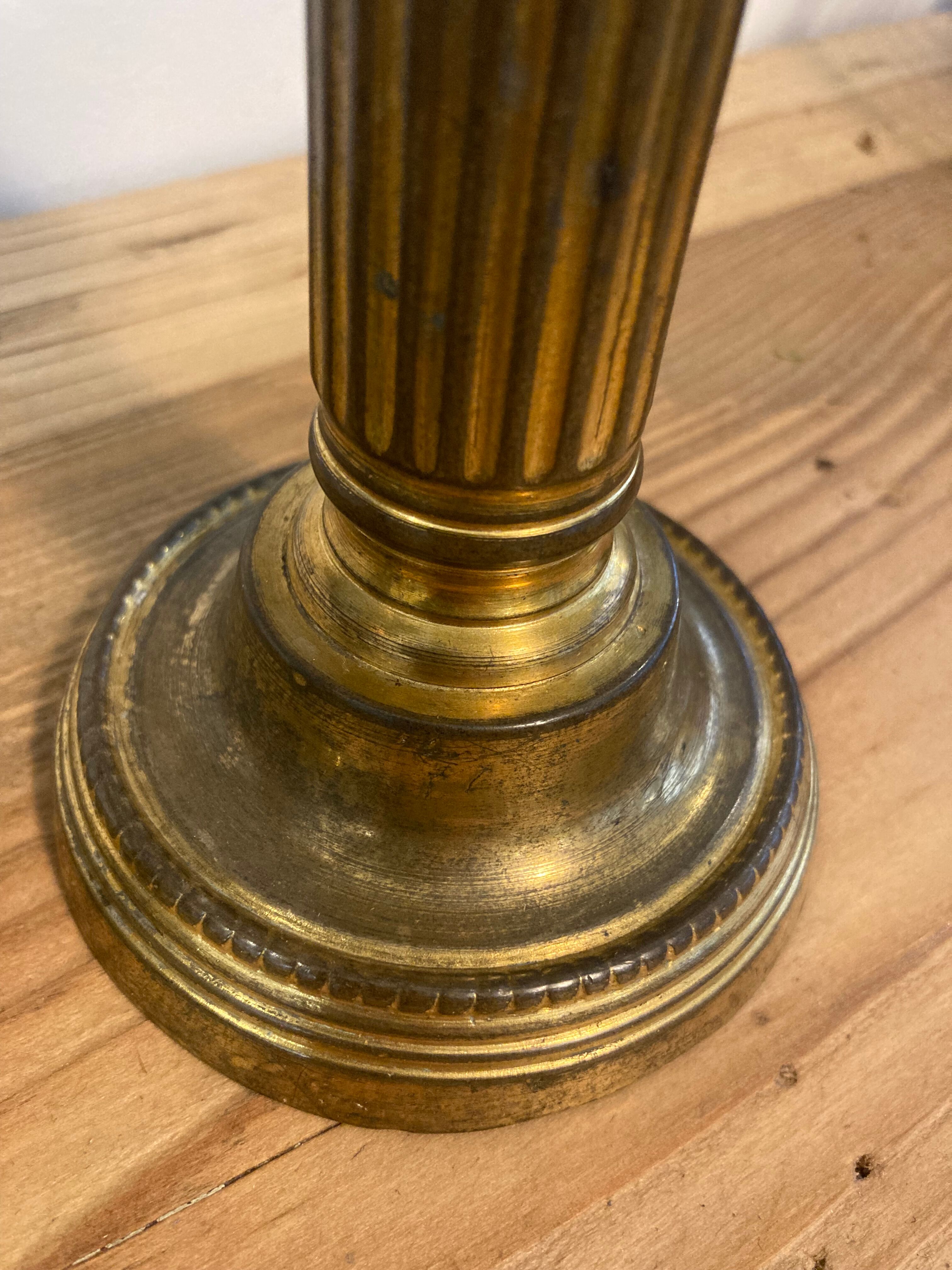 Pair of Louis XVI candlesticks in gilded bronze