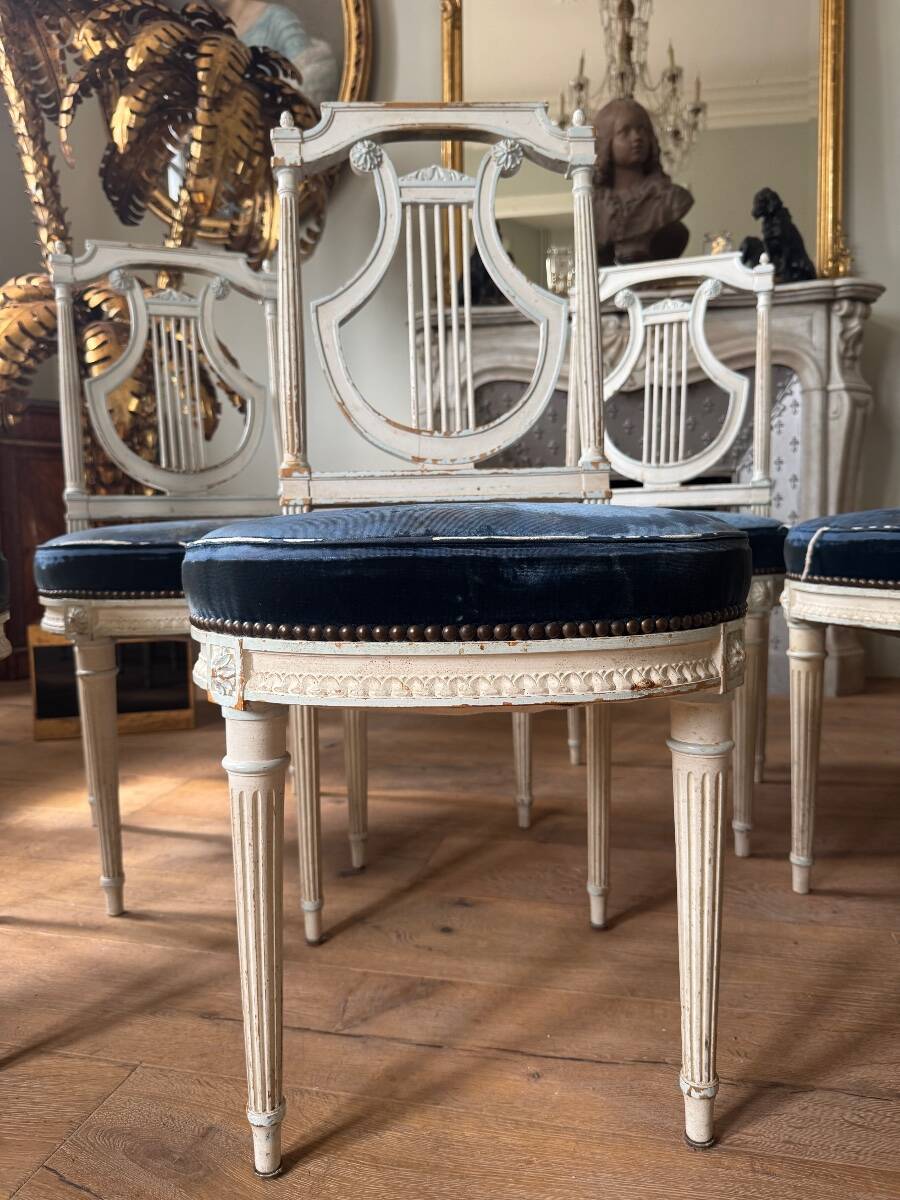 Set of 6 lyre chairs from the Napoleonic III period in painted wood in the Louis XVI style.