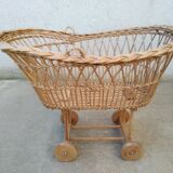Rattan cradle for doll on vintage wheels