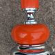 Designer lamp from the 70s in chrome metal and orange lacquered wood