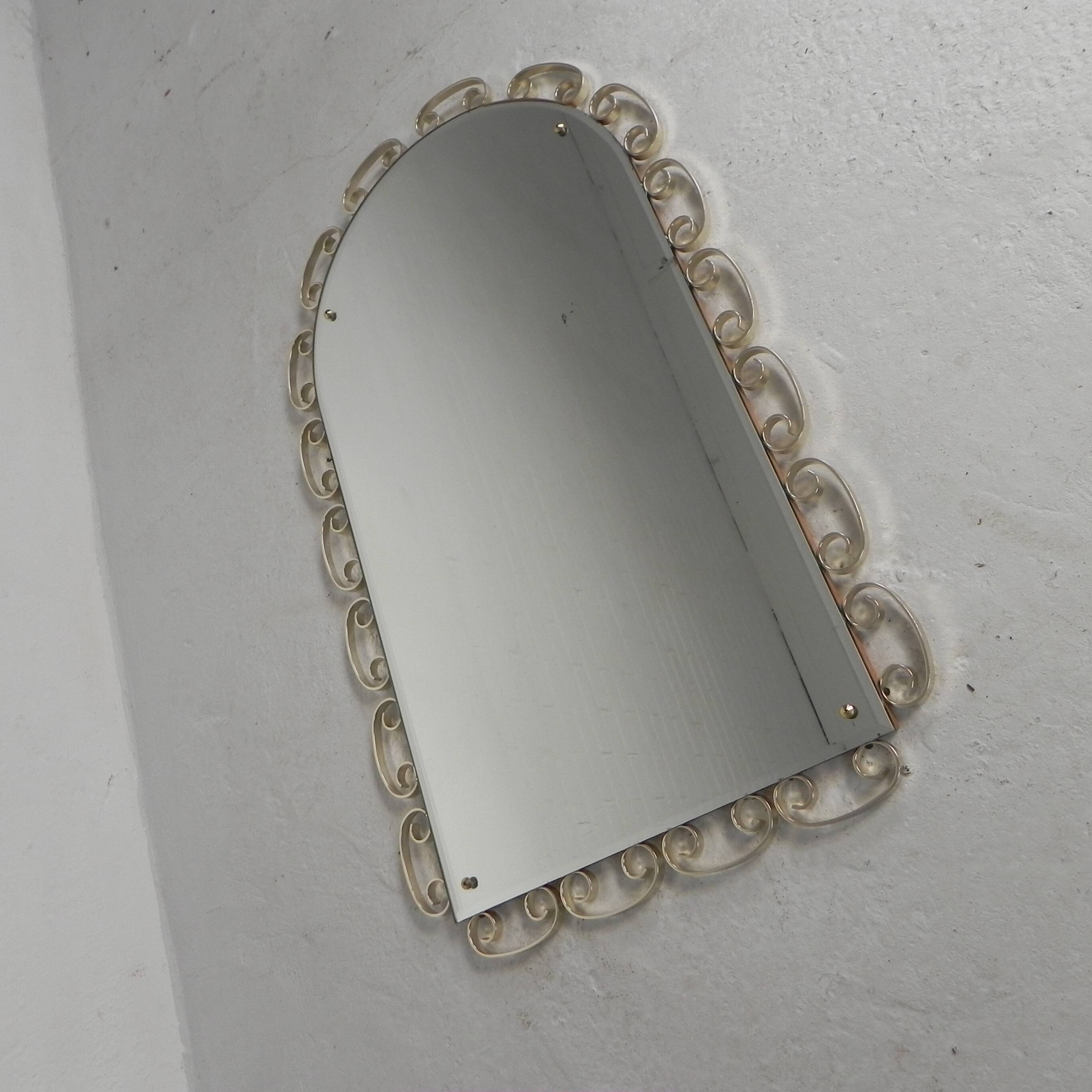 Vintage faceted mirror in an aluminium frame from the 1950s.