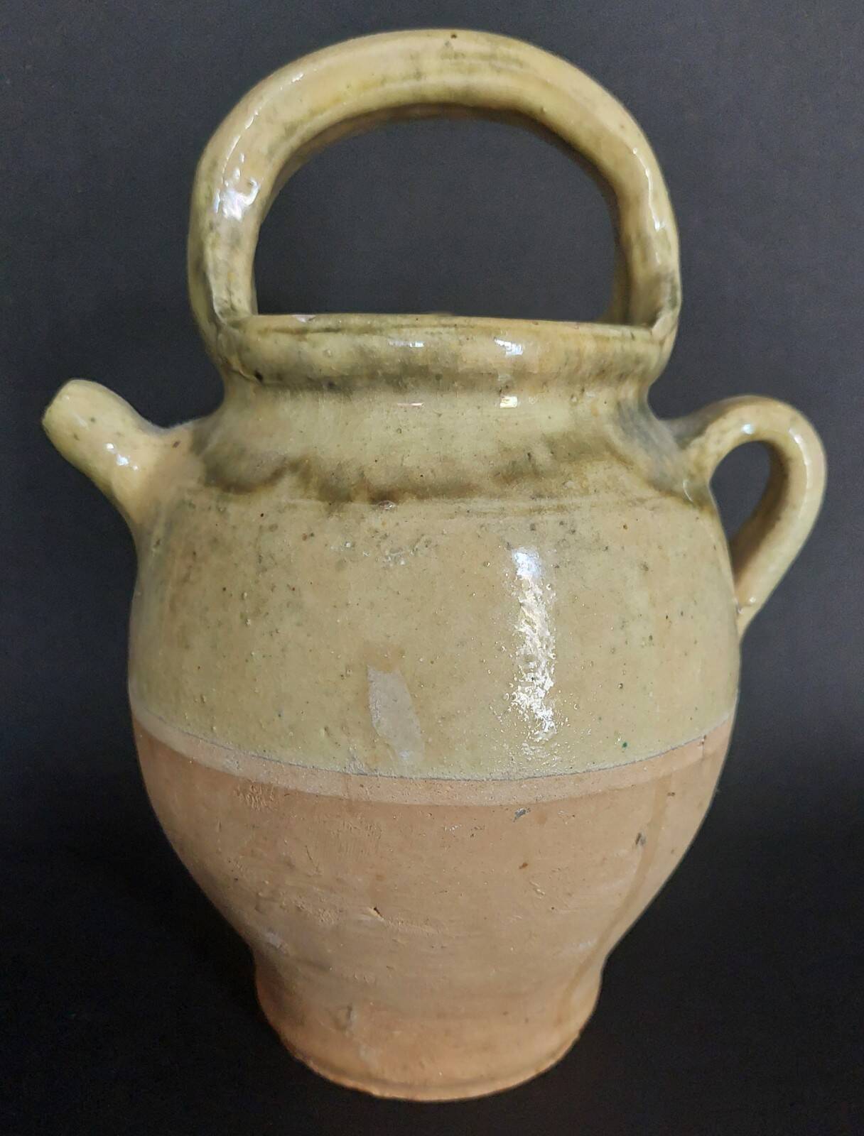 Yellow glazed terracotta gargoulette carafe with lid, early 20th century.