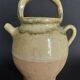 Yellow glazed terracotta gargoulette carafe with lid, early 20th century.