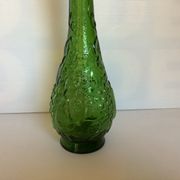 Green carafe bottle with apple, pear, and grape pattern from Italy.