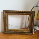 Frame with channels in wood and gilded stucco