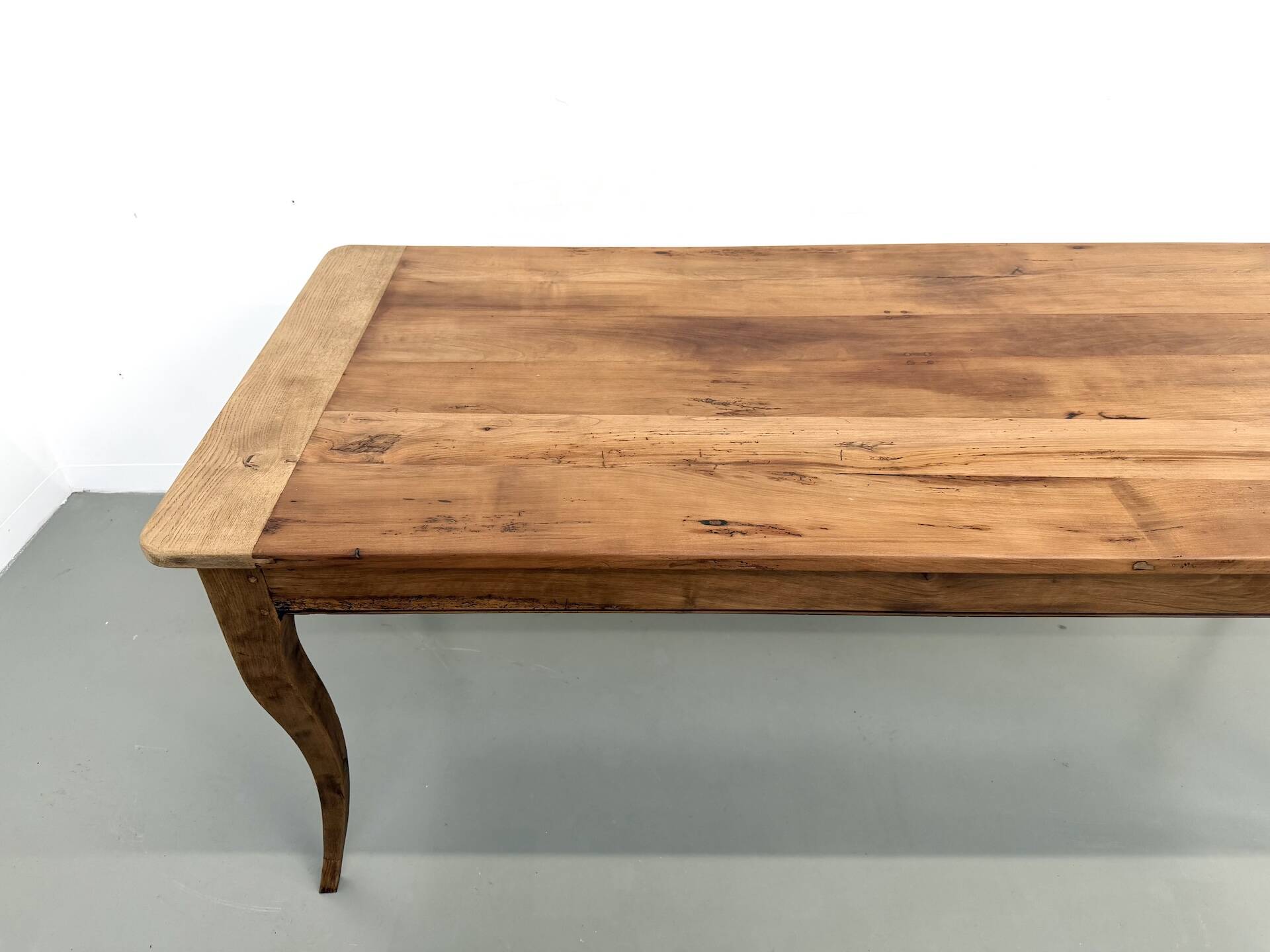 Farm table in solid cherry — Saber legs, Circa 1880