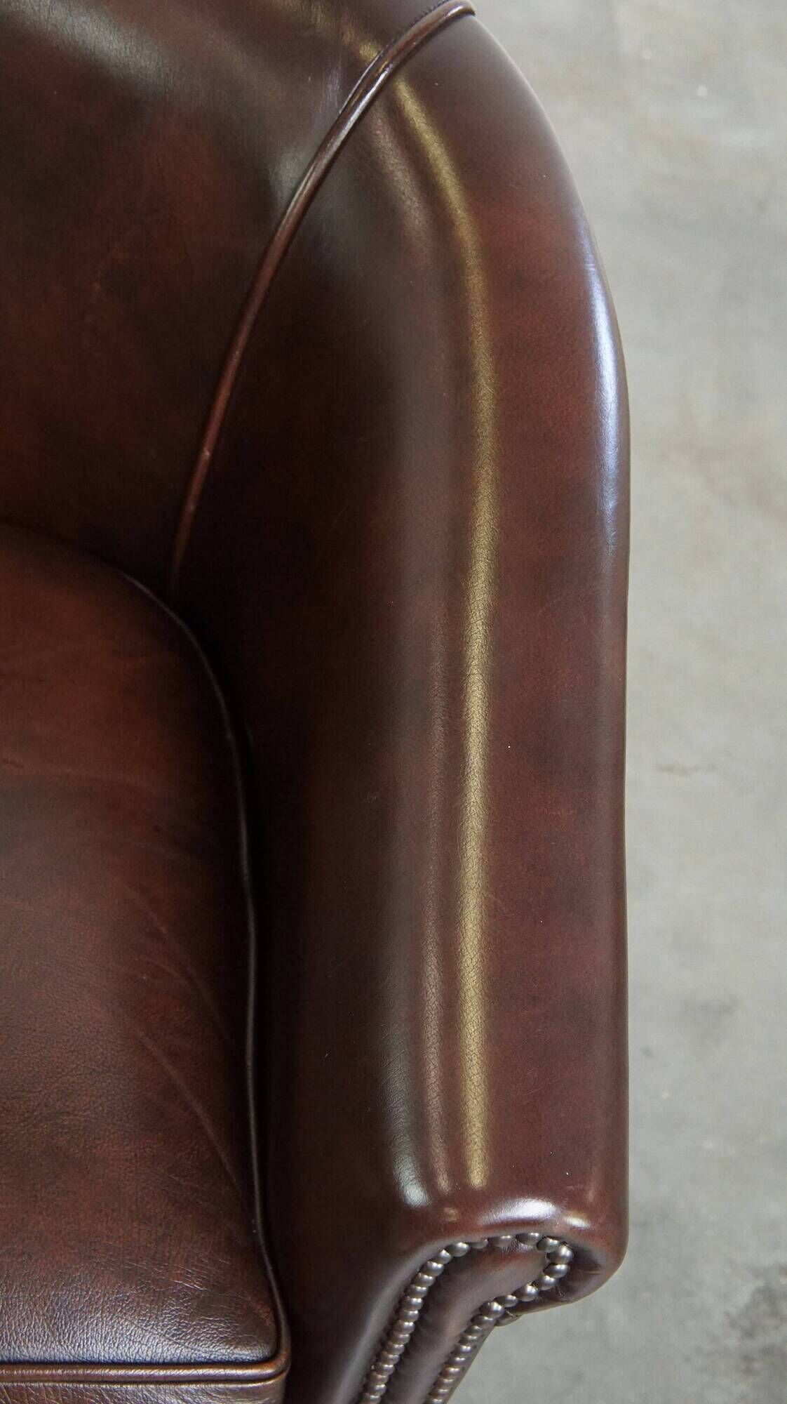 dark cowhide club chair in English style