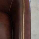 dark cowhide club chair in English style