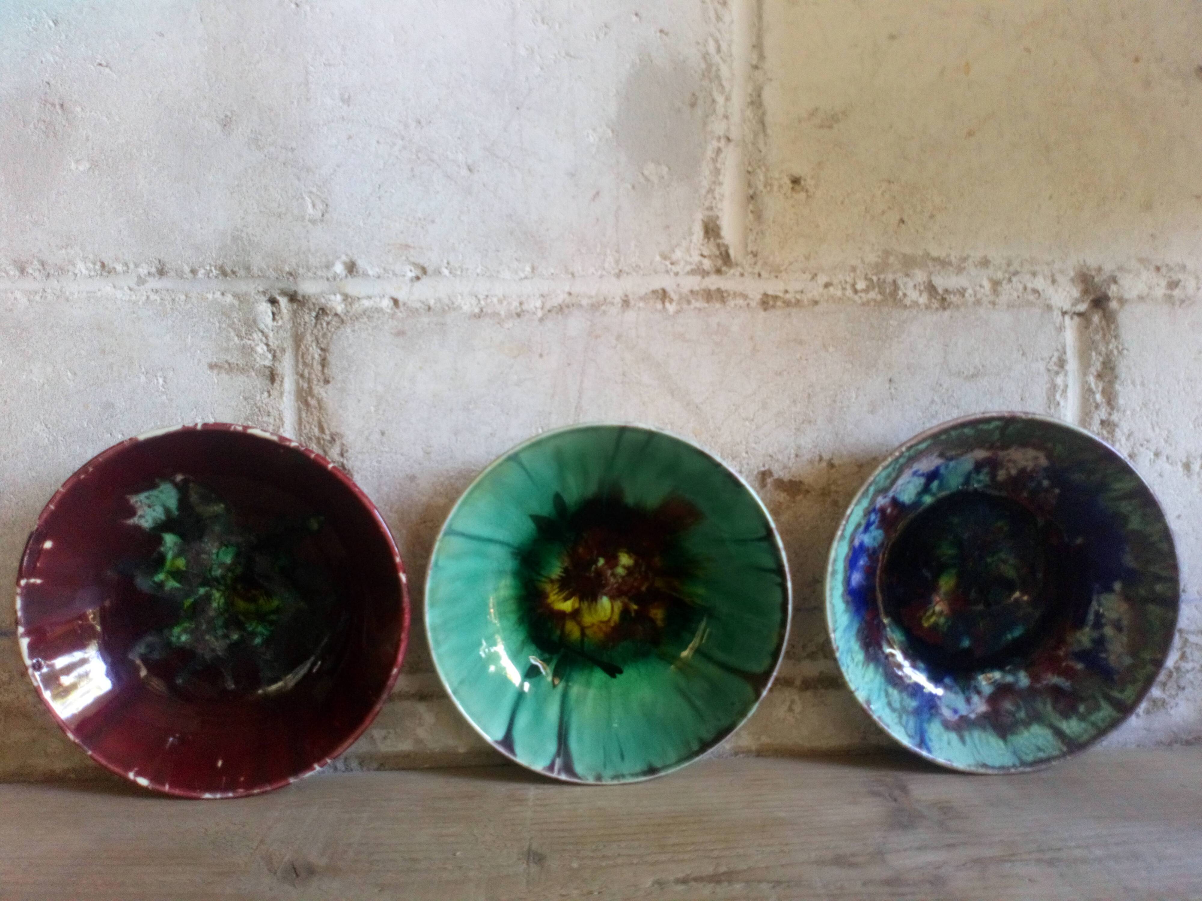 Seven plates of potter with multicolored enamels