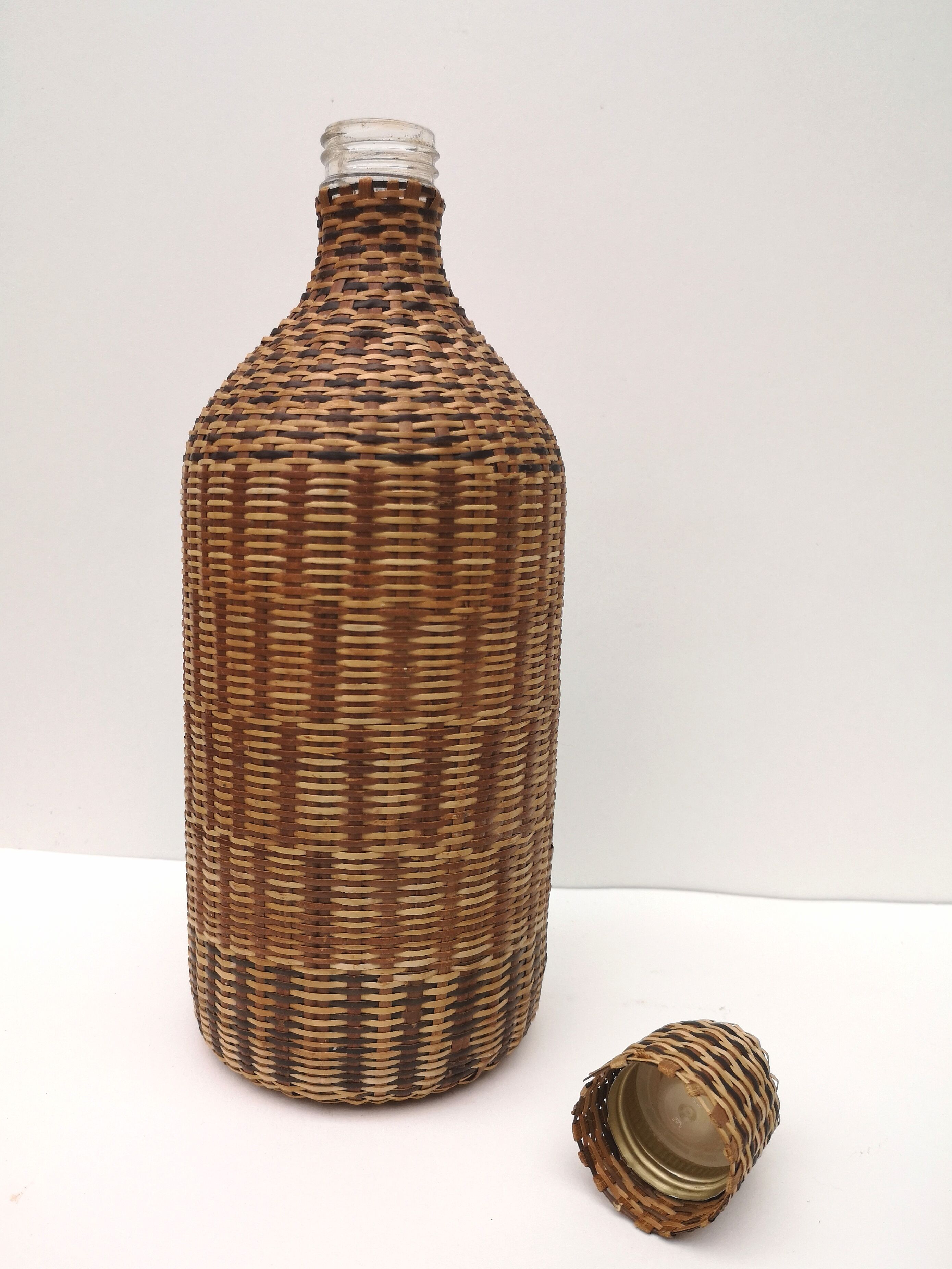 Vintage bottle in braided straw