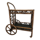 Bamboo and rattan dessert table in peacock style.