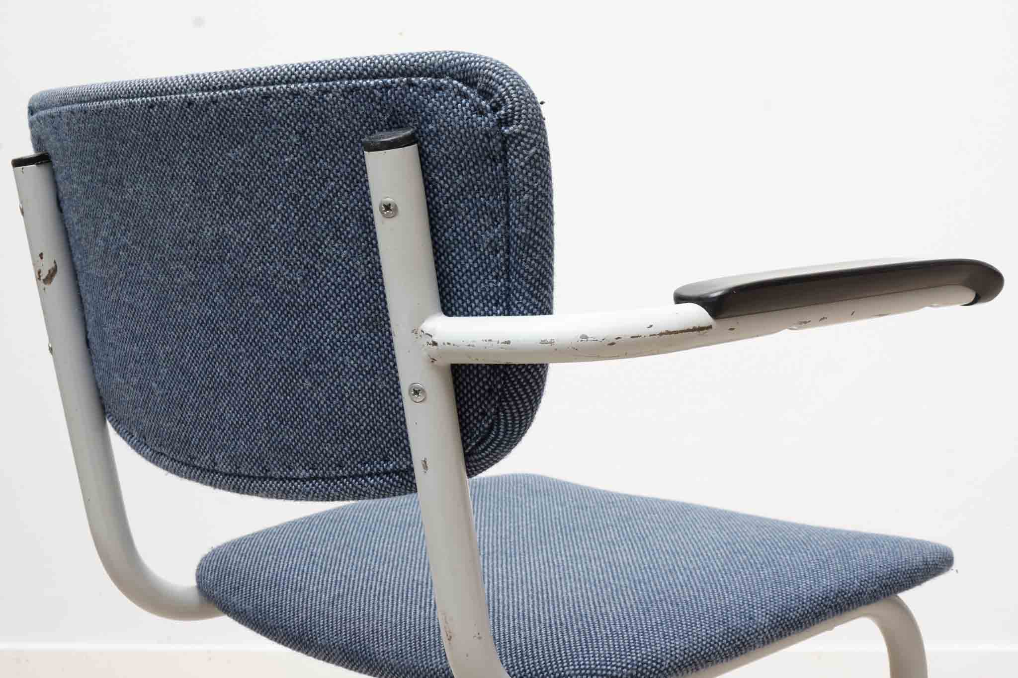 Blue fabric S-shaped chair with armrests