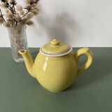 Small lemon yellow porcelain teapot with filter