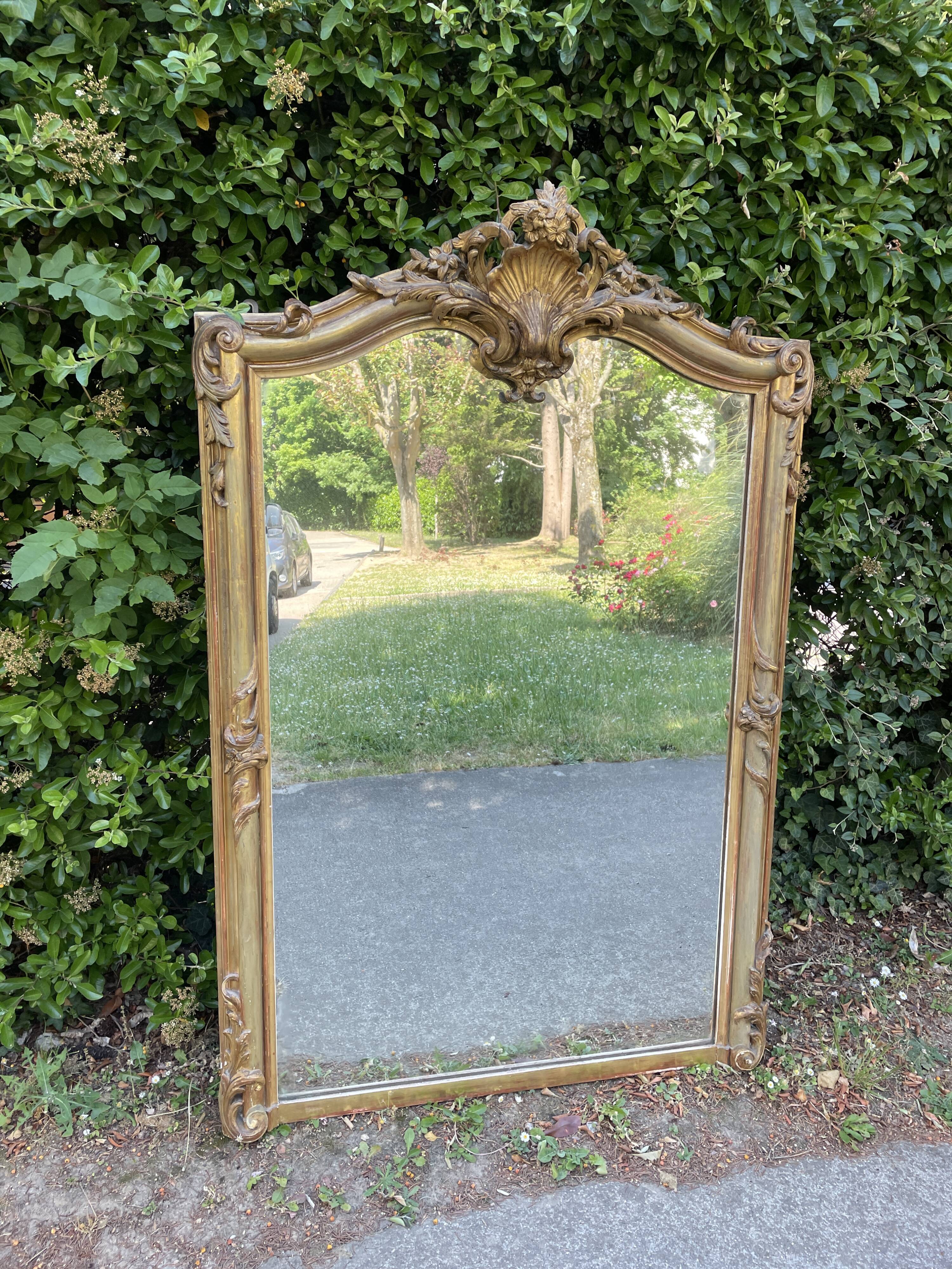 Old Louis XV style mirror in wood and gilded stucco. Napoleon III