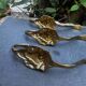 3 lion coat hooks in brass Art Nouveau